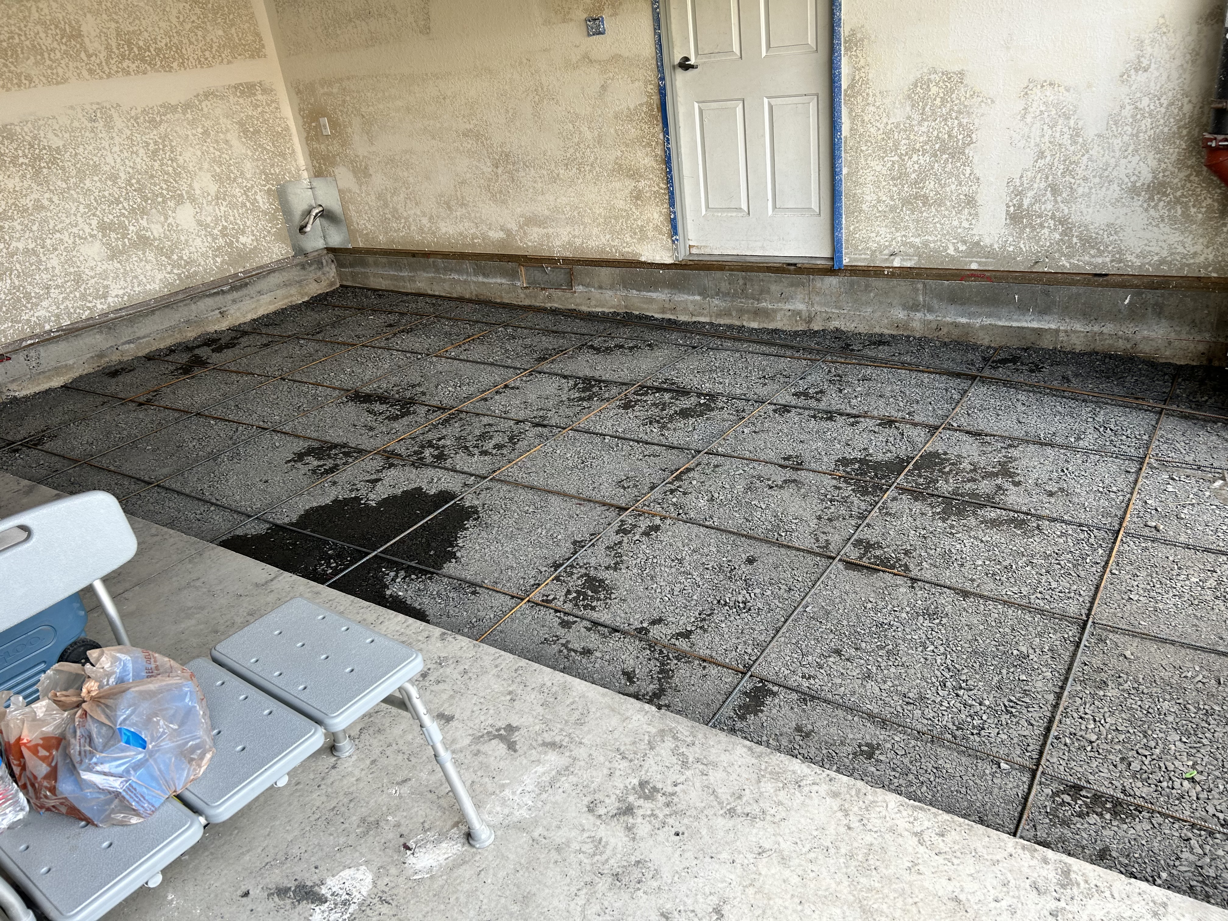 Concrete rebar grid ready for pour – garage floor prep