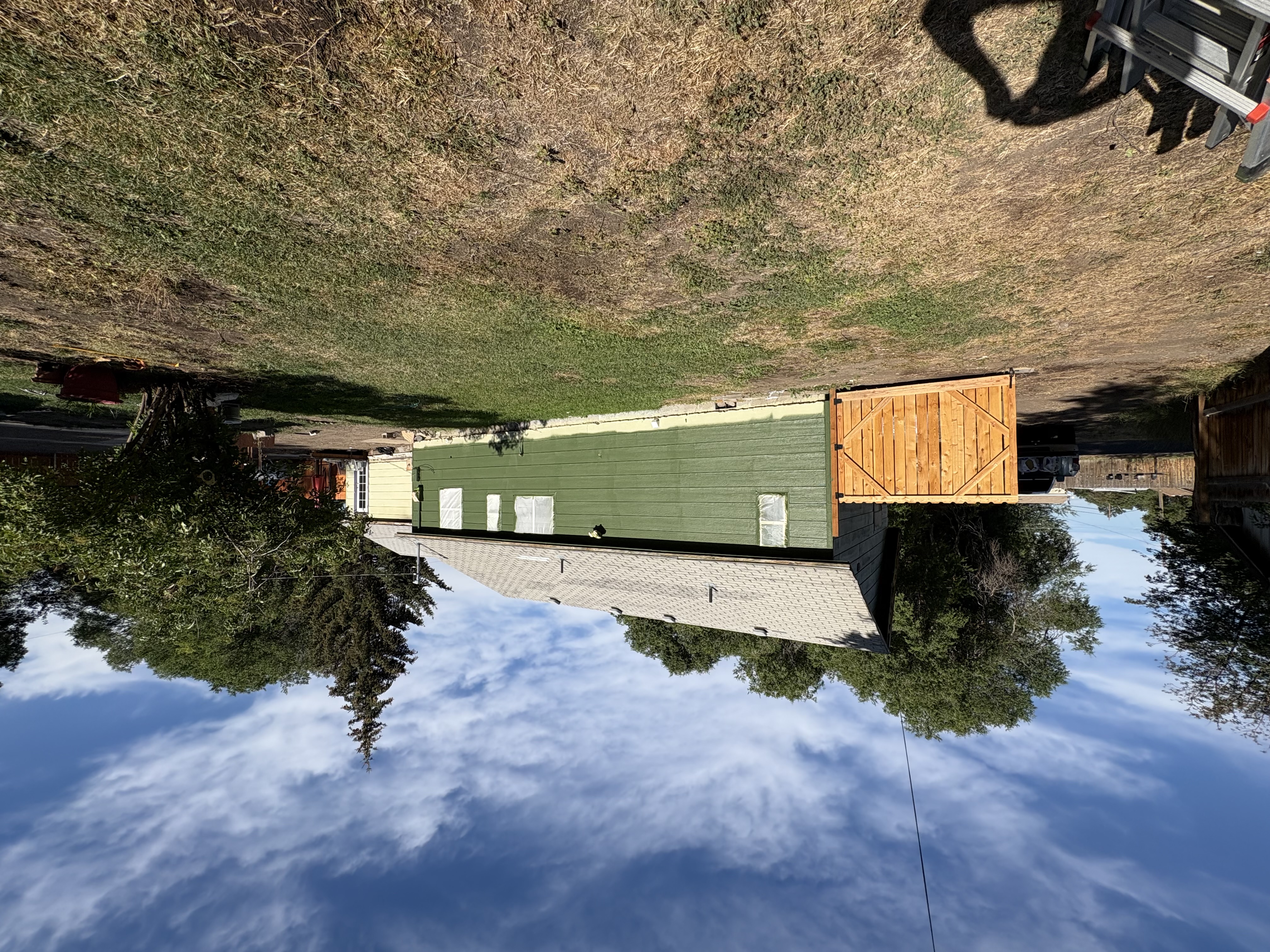 New cedar gate install – green house side view with lawn