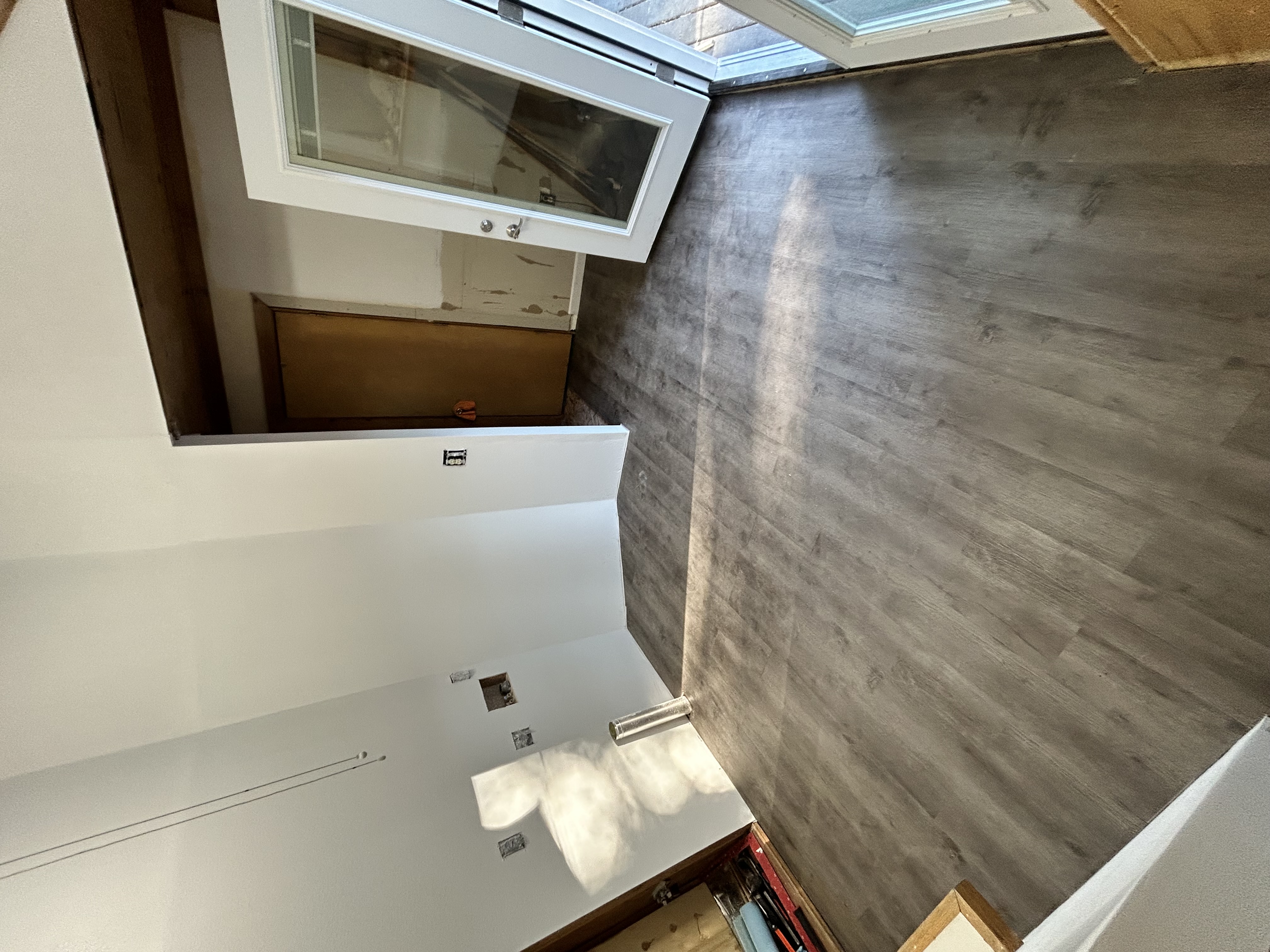 LVP dark plank flooring – open room install